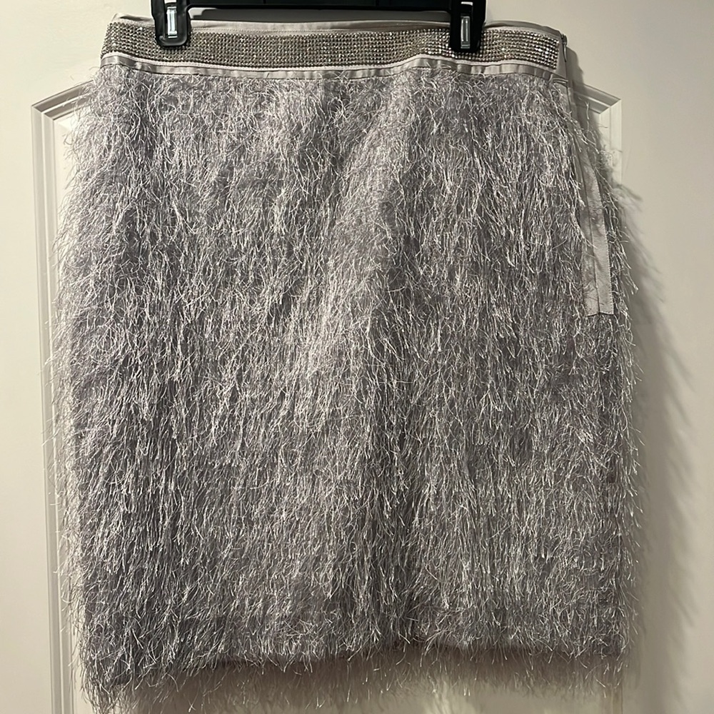 Custom made silver feather, satin and rhinestone skirt. Size 16